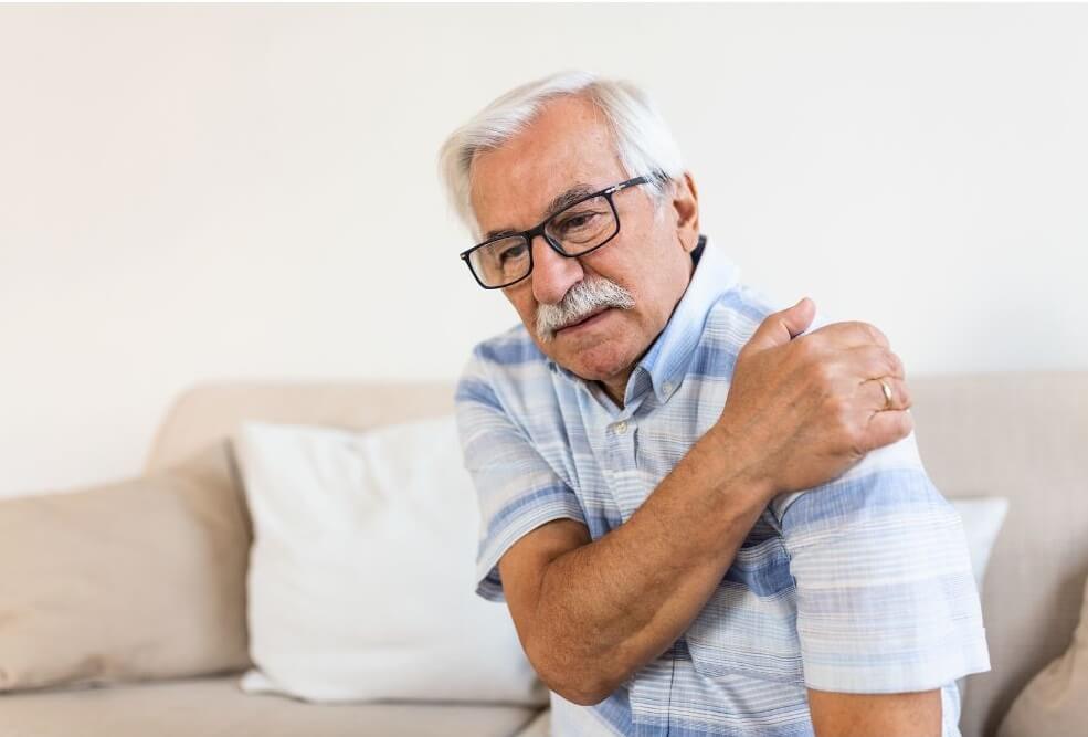 Elderly Man Suffering From A Shoulder Injury